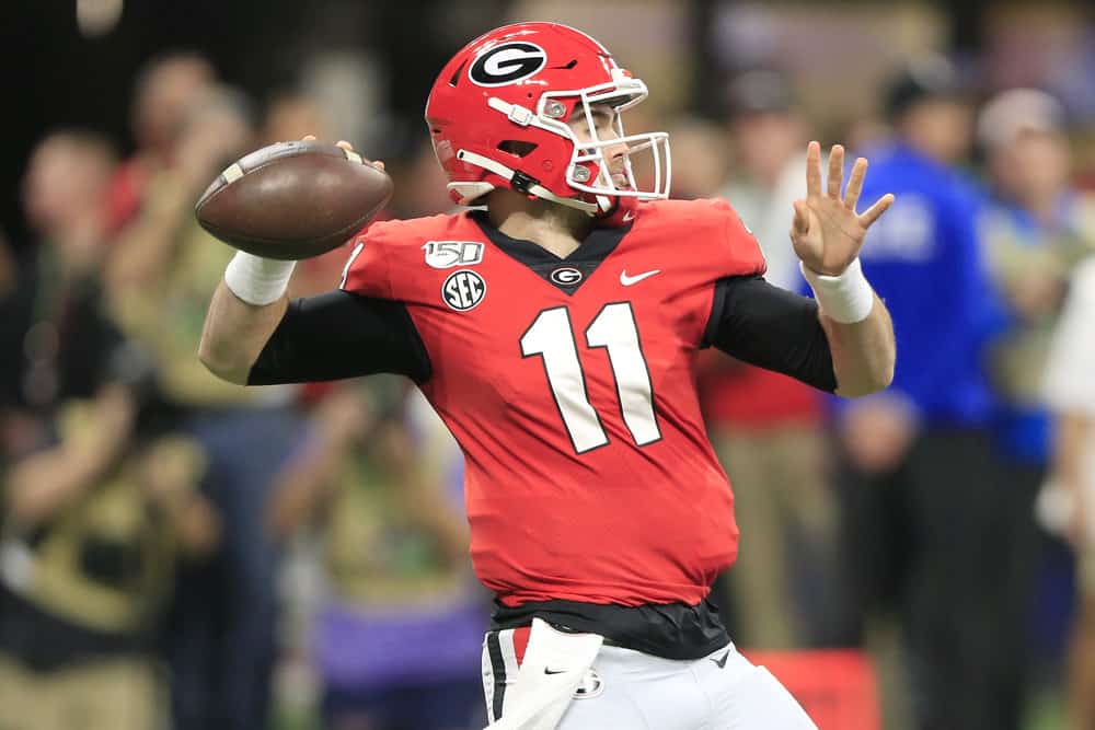 Quarterback Jake Fromm (11) of the Georgia Bulldogs passes during the SEC Championship Game between the UGA Bulldogs and the LSU Tigers on December 7, 2019 at the Mercedes-Benz Stadium in Atlanta, Georgia.