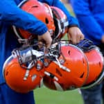 browns helmets CLEVELAND, OH - OCTOBER 13: A Cleveland Browns equipment manager carries Browns helmets from the field following the National Football League game between the Seattle Seahawks and Cleveland Browns on October 13, 2019, at FirstEnergy Stadium in Cleveland, OH.