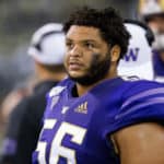 Washington Huskies offensive lineman Nick Harris (56) watches the big screen on the sidelines during a game between the Washington Huskies and the California Golden Bears on Saturday, September 7, 2019 at Husky Stadium in Seattle, WA.