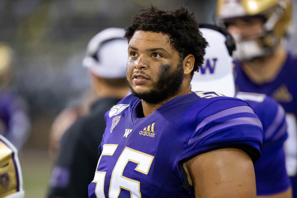 Washington Huskies offensive lineman Nick Harris (56) watches the big screen on the sidelines during a game between the Washington Huskies and the California Golden Bears on Saturday, September 7, 2019 at Husky Stadium in Seattle, WA.