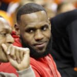 Lebron James of the Los Angeles Lakers talks with Rajon Ronodo during a game between the Duke Blue Devils and the University of Virginia Cavaliers at the John Paul Jones Arena in Charlottesville, Virginia on February 9, 2019.