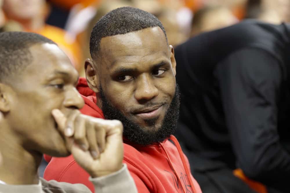 Lebron James of the Los Angeles Lakers talks with Rajon Ronodo during a game between the Duke Blue Devils and the University of Virginia Cavaliers at the John Paul Jones Arena in Charlottesville, Virginia on February 9, 2019.