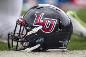 A Liberty Flames helmet on the turf during warmups prior to the game between the Liberty Flames and the West Virginia Mountaineers at Mountaineer Field at Milan Puskar Stadium in Morgantown, WV. West Virginia defeated Liberty 41-17.