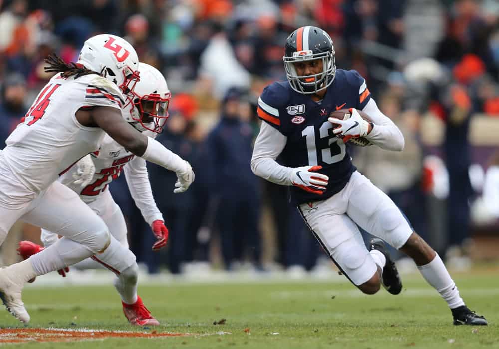 Virginia Cavaliers wide receiver Terrell Jana (13) rushes up field attempting to elude Liberty Flames linebacker Solomon Ajayi (14) during a game between the Liberty Flames and the Virginia Cavaliers on November 23, 2019, at Scott Stadium in Charlottesville, VA.