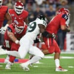 Sacramento State (99) George Obinna (DL) sacks Fresno State (11) Jorge Reyna (QB) during a college football game between the Sacramento State Hornets and the Fresno State Bulldogs on September 21, 2019, at Bulldog Stadium in Fresno, CA.