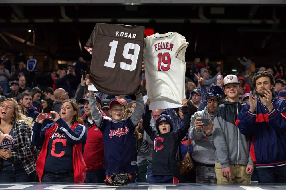 Cleveland Indians fans hold up the number 19 jerseys of Cleveland sports greats Bernie Kosar and Bob Feller in honor of the Indians nineteenth straight victory following the Major League Baseball game between the Detroit Tigers and Cleveland Indians on September 11, 2017, at Progressive Field in Cleveland, OH. Cleveland defeated Detroit 11-0.