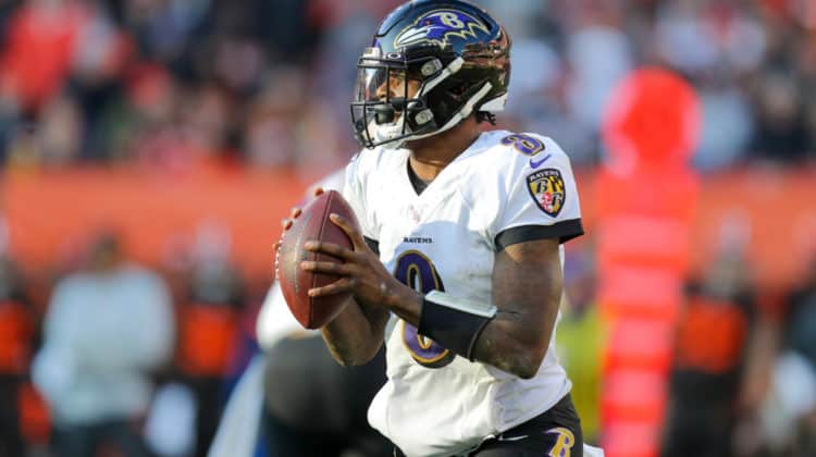 Baltimore Ravens quarterback Lamar Jackson (8) looks to pass during the third quarter of the National Football League game between the Baltimore Ravens and Cleveland Browns on December 22, 2019, at FirstEnergy Stadium in Cleveland, OH.