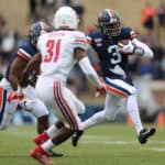 CHARLOTTESVILLE, VA - NOVEMBER 23: Virginia Cavaliers quarterback Bryce Perkins (3) rushes up field attempting to elude Liberty Flames linebacker Elijah Benton (31) during a game between the Liberty Flames and the Virginia Cavaliers on November 23, 2019, at Scott Stadium in Charlottesville, VA.