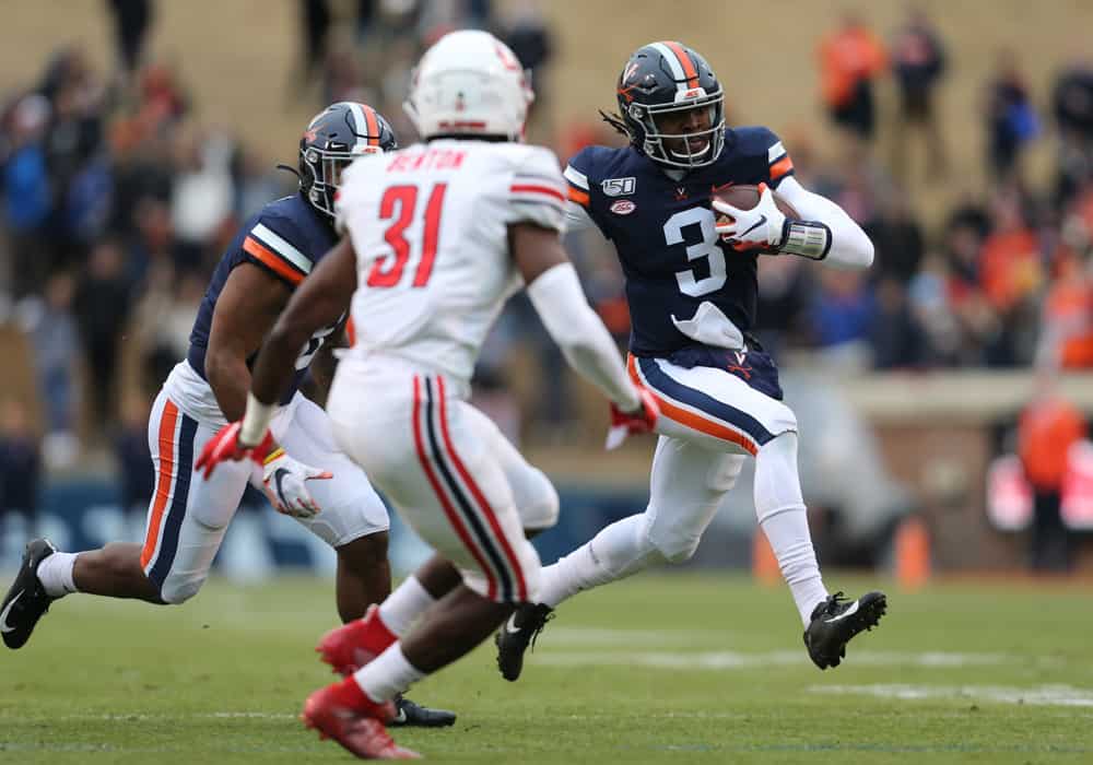 CHARLOTTESVILLE, VA - NOVEMBER 23: Virginia Cavaliers quarterback Bryce Perkins (3) rushes up field attempting to elude Liberty Flames linebacker Elijah Benton (31) during a game between the Liberty Flames and the Virginia Cavaliers on November 23, 2019, at Scott Stadium in Charlottesville, VA.