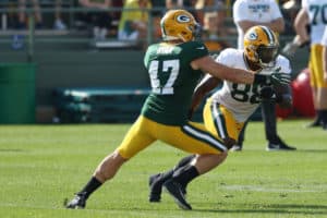 Green Bay Packers linebacker Jake Ryan (47) holds up Green Bay Packers running back Ty Montgomery (88) during Packers training camp at Ray Nitschke Field on August 1, 2017 in Green Bay, WI.