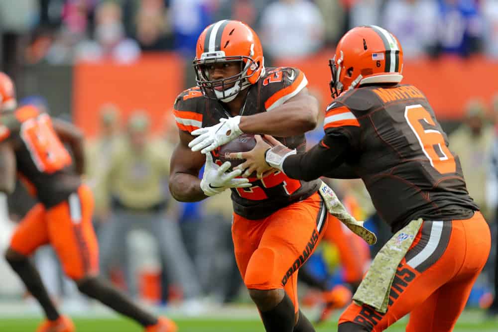 Cleveland Browns running back Nick Chubb (24) takes a handoff from Cleveland Browns quarterback Baker Mayfield (6) during the first quarter of the National Football League game between the Buffalo Bills and Cleveland Browns on November 10, 2019, at FirstEnergy Stadium in Cleveland, OH.