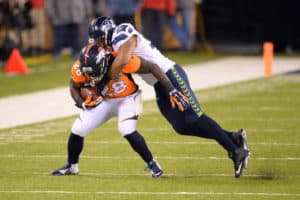 Seattle Seahawks outside linebacker Malcolm Smith (53) tackles Denver Broncos running back Montee Ball (28) during Super Bowl XLVIII between the Denver Broncos and the Seattle Seahawks at MetLife Stadium in East Rutherford, NJ The Seahawks defeated the Broncos 43-8.