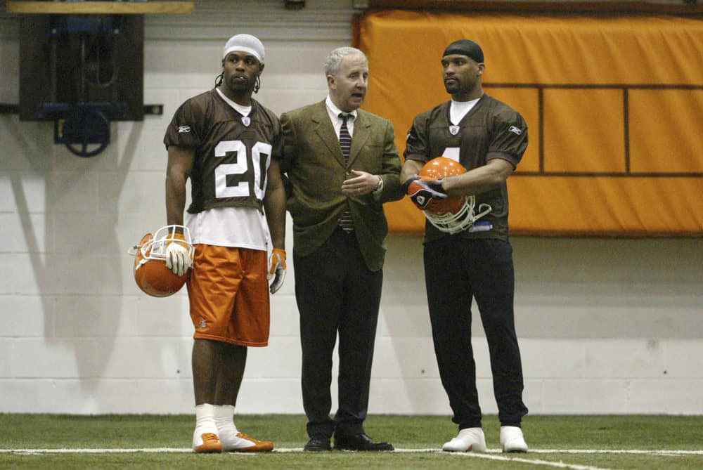 Cleveland Browns owner Randy Lerner talks with Earl Little (20) and Robert Griffith during the first day of mini camp at the Browns practice facility in Berea, Ohio. 