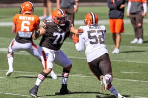 Cleveland Browns tackle Jedrick Wills Jr. (71) blocks Cleveland Browns defensive end Robert McCray (52) during drills during the Cleveland Browns Training Camp on August 30, 2020, at FirstEnergy Stadium in Cleveland, OH.