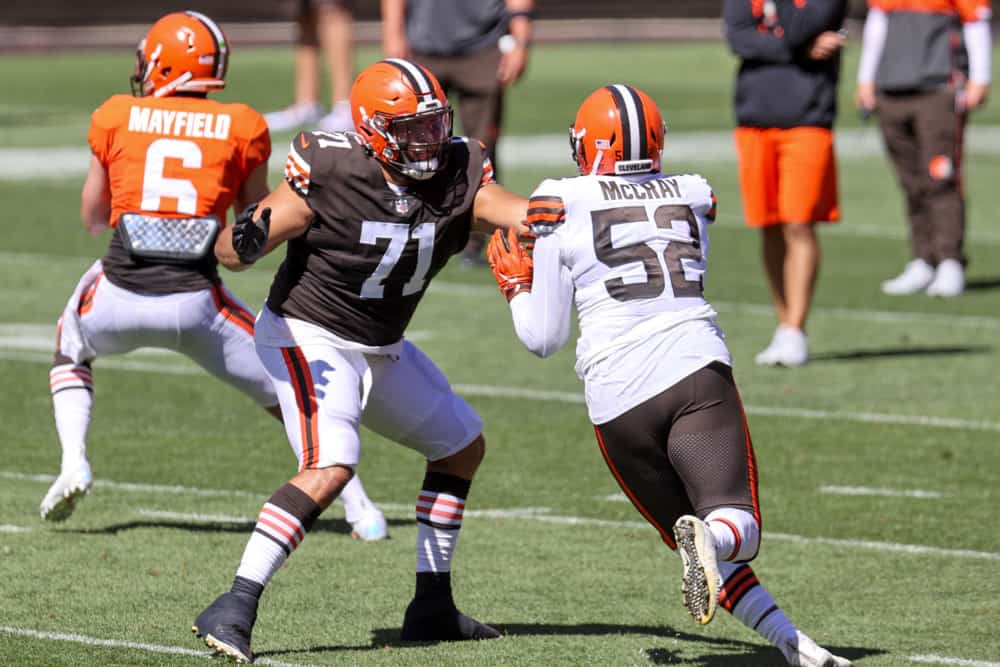 Cleveland Browns tackle Jedrick Wills Jr. (71) blocks Cleveland Browns defensive end Robert McCray (52) during drills during the Cleveland Browns Training Camp on August 30, 2020, at FirstEnergy Stadium in Cleveland, OH.