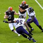 Cleveland Browns quarterback Baker Mayfield (6) scramble away from the pressure of Baltimore Ravens defensive end Derek Wolfe (95) and defensive end Jihad Ward (53) on September 13, 2020, at M&T Bank Stadium in Baltimore, MD.