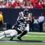 Jacksonville Jaguars defensive back Ronnie Harrison (36) brings down Houston Texans tight end Jordan Akins (88) during the football game between the Houston Texans and Jacksonville Jaguars at NRG Stadium on September 15, 2019 in Houston, Texas.