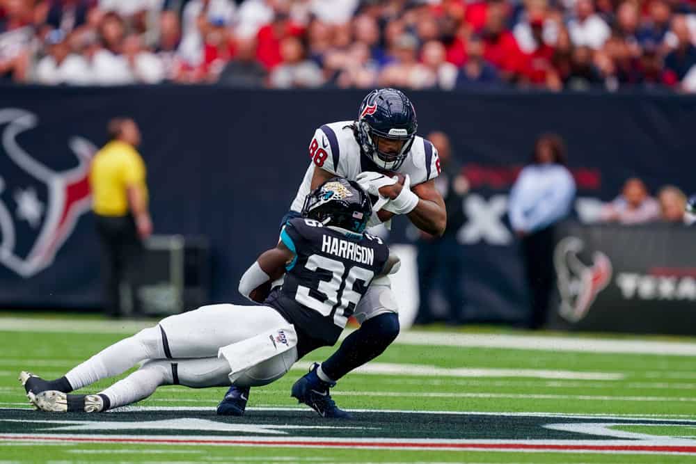 Jacksonville Jaguars defensive back Ronnie Harrison (36) brings down Houston Texans tight end Jordan Akins (88) during the football game between the Houston Texans and Jacksonville Jaguars at NRG Stadium on September 15, 2019 in Houston, Texas. 