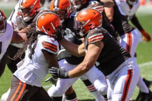 Cleveland Browns tackle Jedrick Wills Jr. (71) blocks Cleveland Browns defensive end Adrian Clayborn (94) during drills during the Cleveland Browns Training Camp on August 30, 2020, at FirstEnergy Stadium in Cleveland, OH.