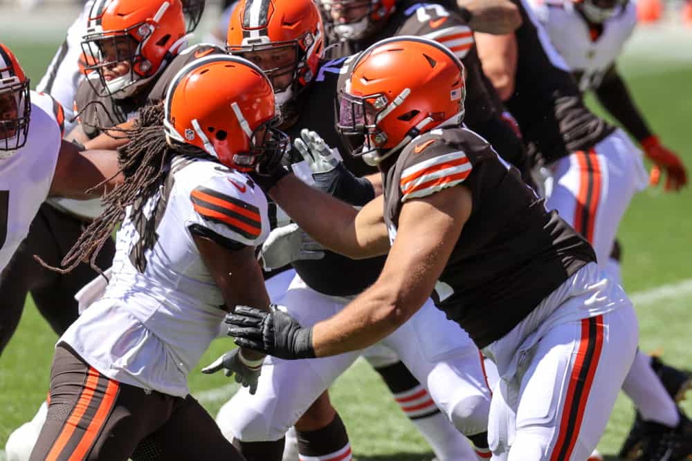 Cleveland Browns tackle Jedrick Wills Jr. (71) blocks Cleveland Browns defensive end Adrian Clayborn (94) during drills during the Cleveland Browns Training Camp on August 30, 2020, at FirstEnergy Stadium in Cleveland, OH.