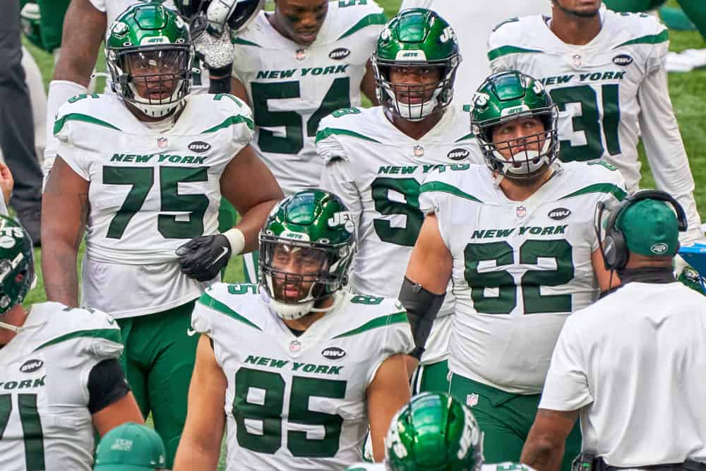 New York Jets offensive guard Greg Van Roten (62), offensive tackle Chuma Edoga (75) and defensive end Kyle Phillips (98) look on in action during a NFL game between the Indianapolis Colts and the New York Jets on September 27, 2020 at Lucas Oil Stadium in Indianapolis, IN.