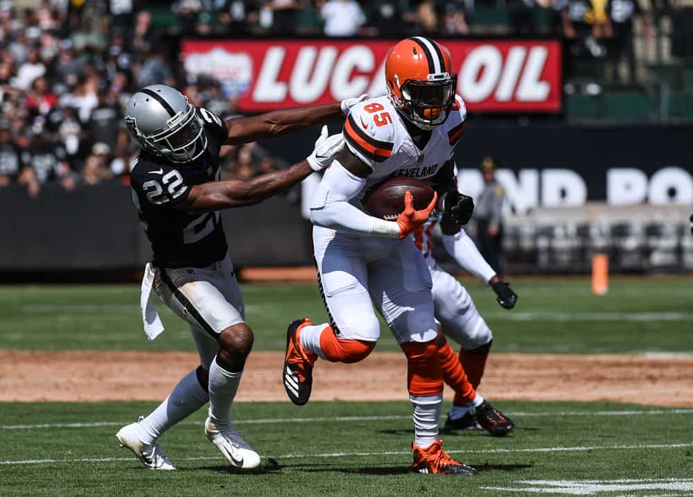 Cleveland Browns Tight End David Njoku (85) is tackled by Oakland Raiders Cornerback Rashaan Melvin (22) during the NFL football game between the Cleveland Browns and the Oakland Raiders on September 30, 2018, at the Oakland Alameda Coliseum in Oakland, CA .