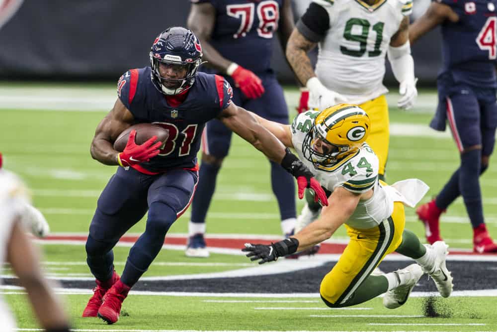 Green Bay Packers linebacker Ty Summers (44) reaches for the tackle of Houston Texans running back David Johnson (31) during the fourth quarter at Texans at NRG Stadium. 