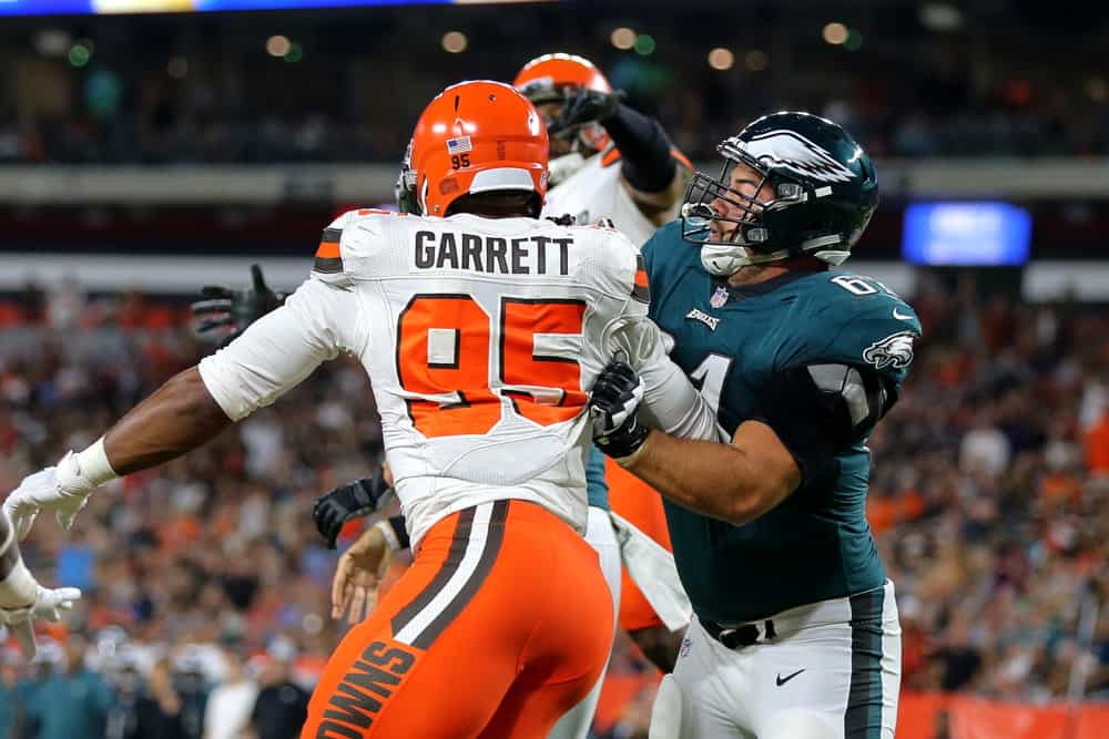 Philadelphia Eagles center Stefen Wisniewski (61) blocks Cleveland Browns defensive end Myles Garrett (95) during the first quarter of the National Football League preseason game between the Philadelphia Eagles and Cleveland Browns on August 23, 2018, at FirstEnergy Stadium in Cleveland, OH. Cleveland defeated Philadelphia 5-0.