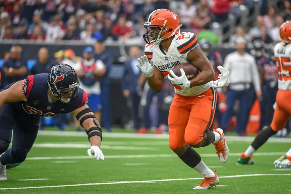 Cleveland Browns Running Back Nick Chubb (24) evades a diving tackle attempt by Houston Texans Defensive End J.J. Watt (99) during the football game between the Cleveland Browns and Houston Texans on December 2, 2018 at NRG Stadium in Houston, Texas. 