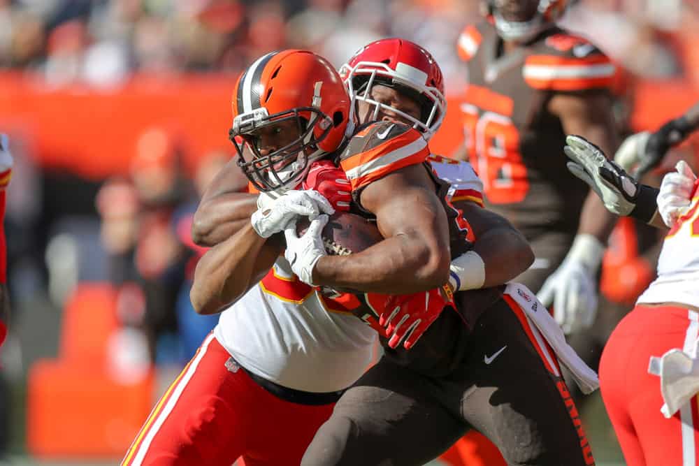 Cleveland Browns running back Nick Chubb (24) is tackled by Kansas City Chiefs linebacker Reggie Ragland (59) during the second quarter of the National Football League game between the Kansas City Chiefs and Cleveland Browns on November 4, 2018, at FirstEnergy Stadium in Cleveland, OH.