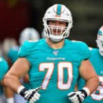 Miami Dolphins guard Michael Dunn (70) enters the field prior to the first half of an NFL preseason game between the Miami Dolphins and the Tampa Bay Bucs on August 16, 2019, at Raymond James Stadium in Tampa, FL.