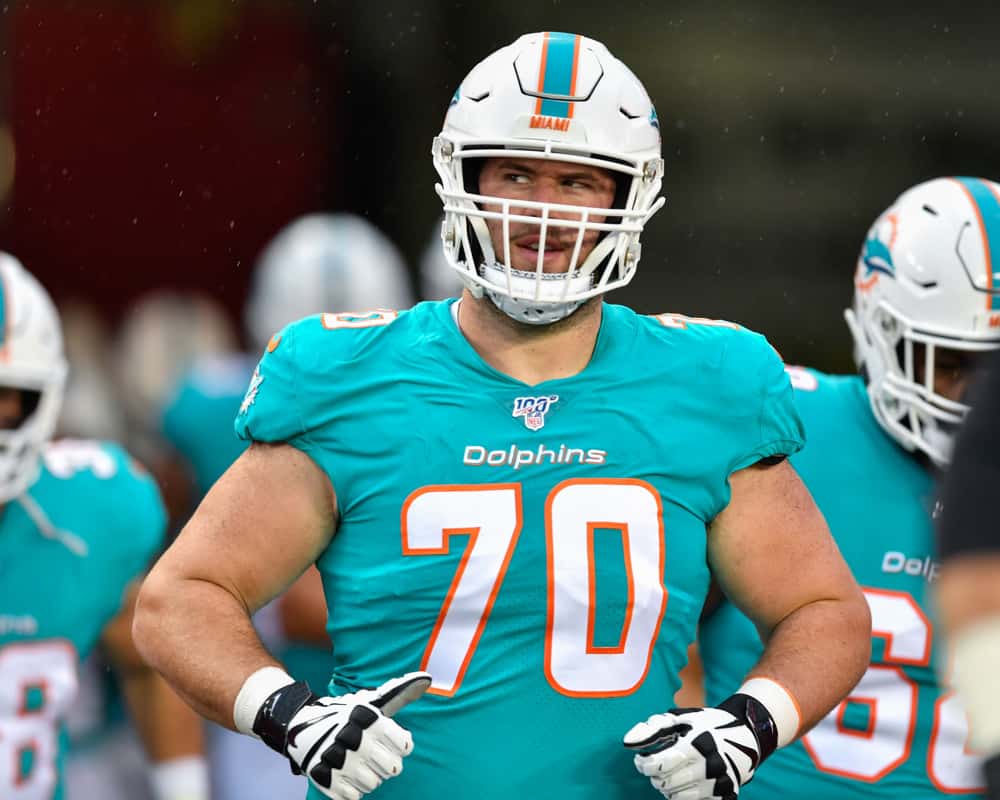 Miami Dolphins guard Michael Dunn (70) enters the field prior to the first half of an NFL preseason game between the Miami Dolphins and the Tampa Bay Bucs on August 16, 2019, at Raymond James Stadium in Tampa, FL.