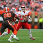 Kansas City Chiefs quarterback Patrick Mahomes (15) looks to pass as Kansas City Chiefs running back Spencer Ware (32) blocks Cleveland Browns defensive end Myles Garrett (95) during the fourth quarter of the National Football League game between the Kansas City Chiefs and Cleveland Browns on November 4, 2018, at FirstEnergy Stadium in Cleveland, OH.