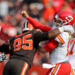 Kansas City Chiefs quarterback Patrick Mahomes (15) is hit by Cleveland Browns defensive end Myles Garrett (95) after throwing a pass during the second quarter of the National Football League game between the Kansas City Chiefs and Cleveland Browns on November 4, 2018, at FirstEnergy Stadium in Cleveland, OH.