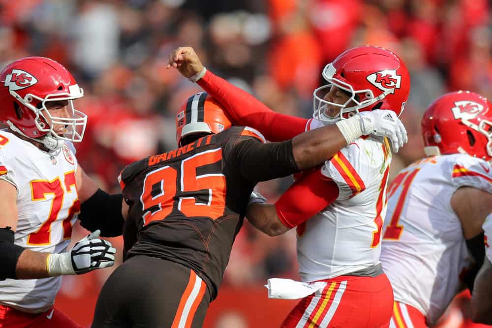 Kansas City Chiefs quarterback Patrick Mahomes (15) is hit by Cleveland Browns defensive end Myles Garrett (95) after throwing a pass during the second quarter of the National Football League game between the Kansas City Chiefs and Cleveland Browns on November 4, 2018, at FirstEnergy Stadium in Cleveland, OH. 