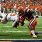 Clemson Tigers Running Back Travis Etienne (9) dives for the end zone and is tackled short of the goal line by Syracuse Orange Defensive Back Andre Cisco (7) during the first quarter of the game between the Clemson Tigers and the Syracuse Orange on September 14, 2019, at the Carrier Dome in Syracuse, NY.
