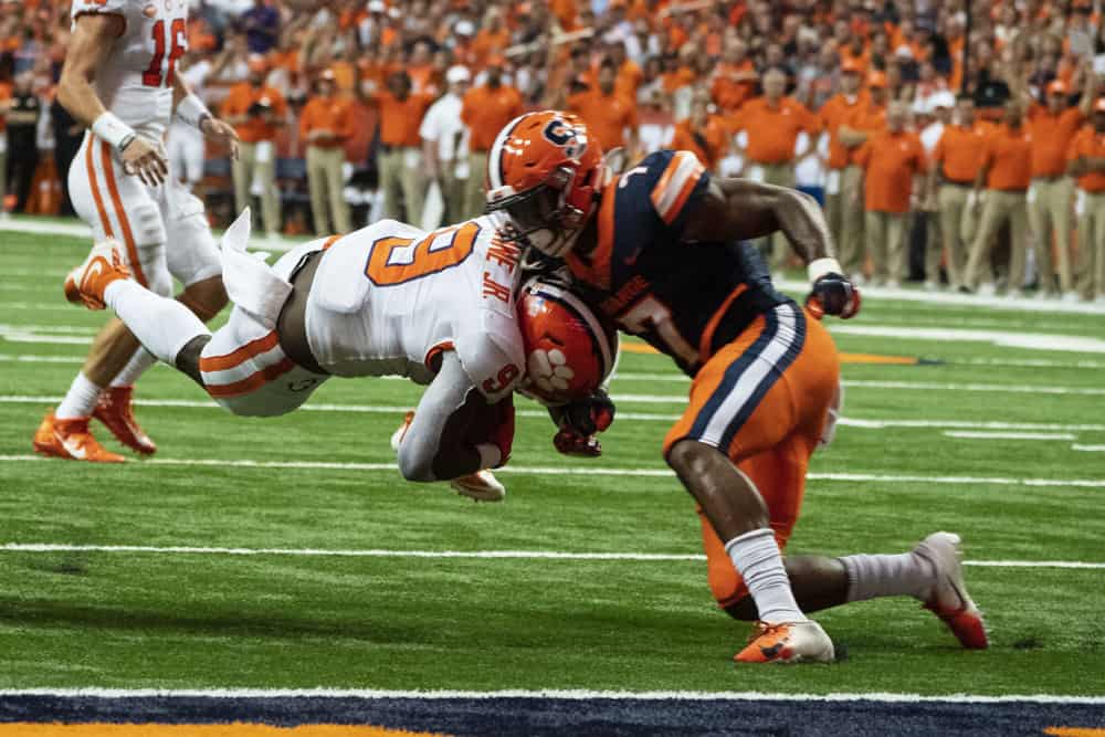 Clemson Tigers Running Back Travis Etienne (9) dives for the end zone and is tackled short of the goal line by Syracuse Orange Defensive Back Andre Cisco (7) during the first quarter of the game between the Clemson Tigers and the Syracuse Orange on September 14, 2019, at the Carrier Dome in Syracuse, NY.