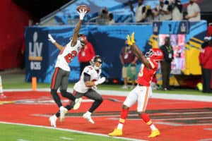 Sean Murphy-Bunting (23) of the Buccaneers tips the ball away from Bryon Pringle (13) of the Chiefs as Antoine Winfield Jr. (31) of the Bucs looks on during the Super Bowl LV game between the Kansas City Chiefs and the Tampa Bay Buccaneers on February 7, 2021 at Raymond James Stadium, in Tampa, FL.