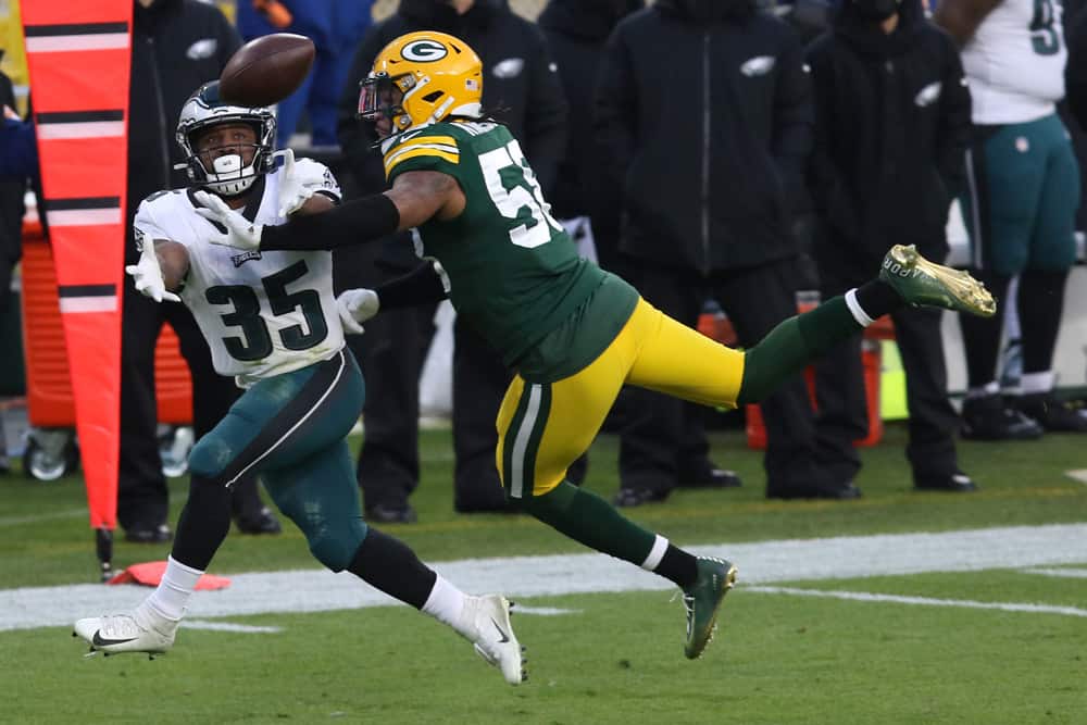 Green Bay Packers inside linebacker Christian Kirksey (58) breaks up a pass intended for Philadelphia Eagles running back Boston Scott (35) during a game between the Green Bay Packers and the Philadelphia Eagles at Lambeau Field on December 6, 2020 in Green Bay WI.