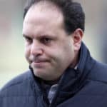 New York Jets GM Mike Tannenbaum walks off the field at the Jets practice facility