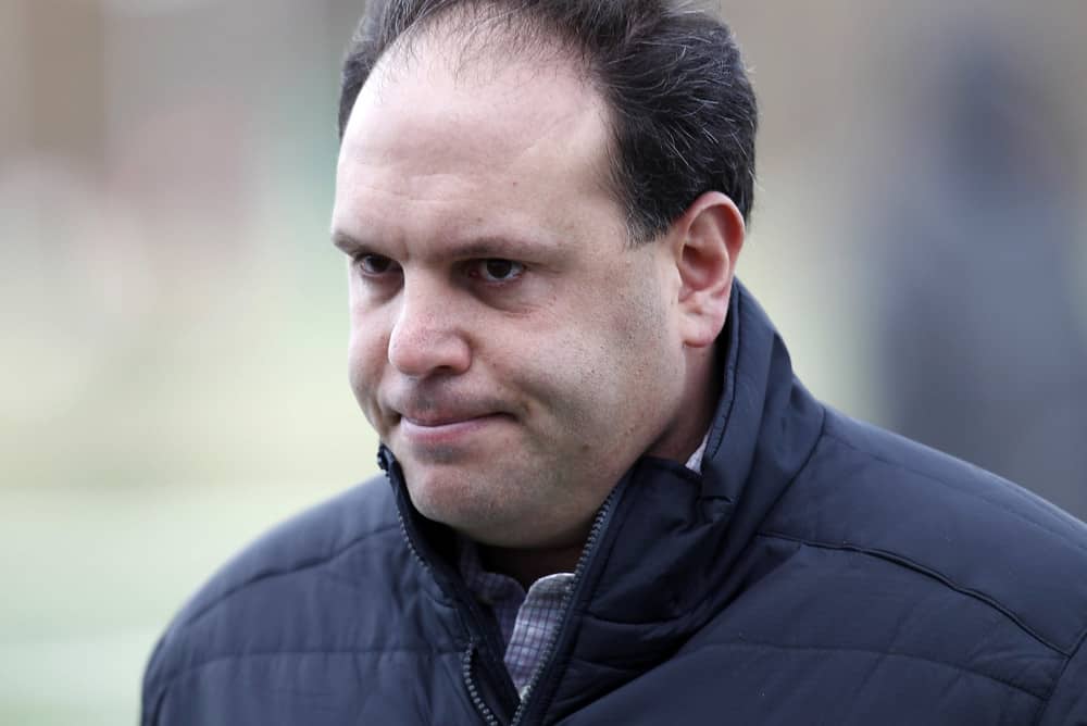 New York Jets GM Mike Tannenbaum walks off the field at the Jets practice facility 