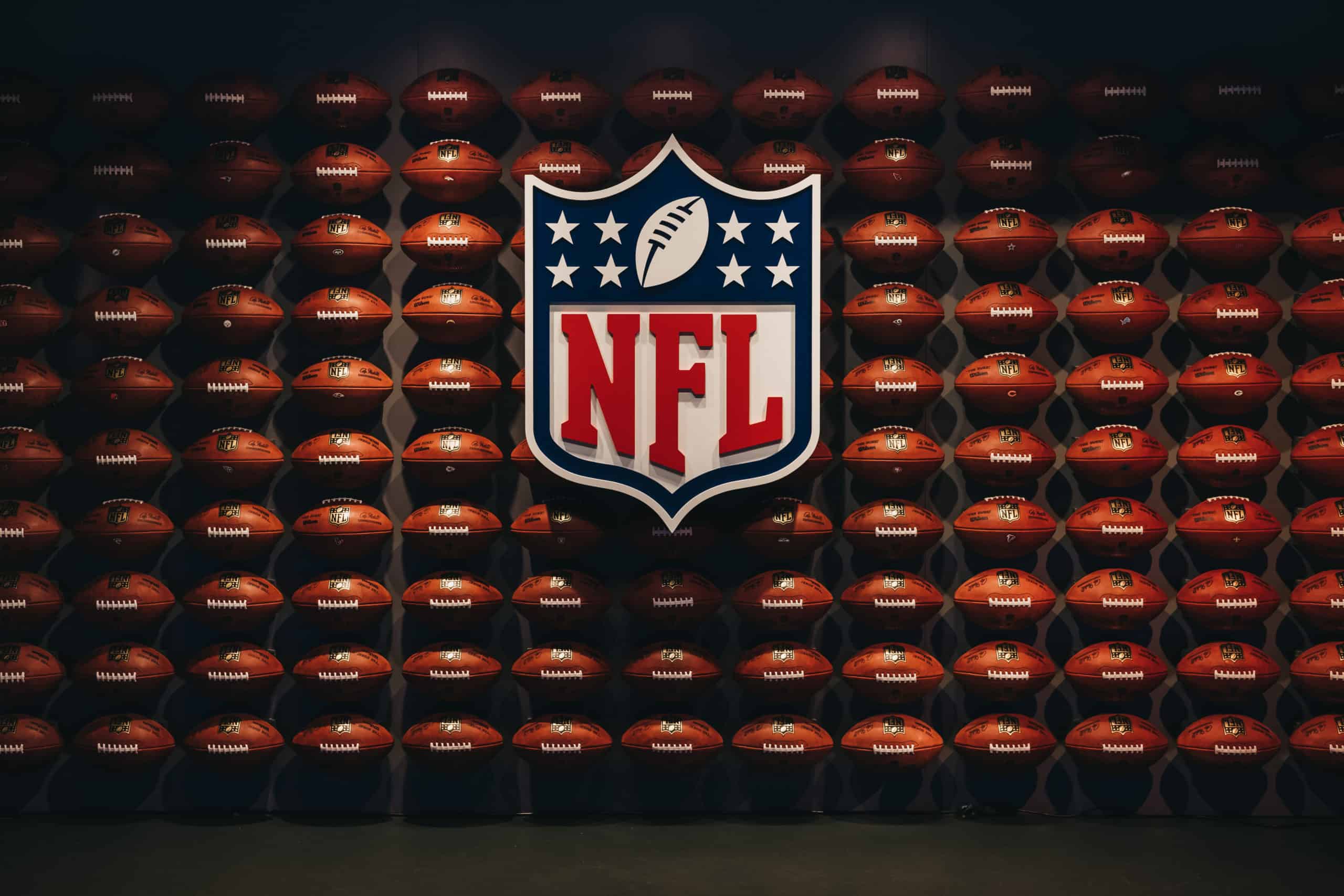 NFL logo with footballs