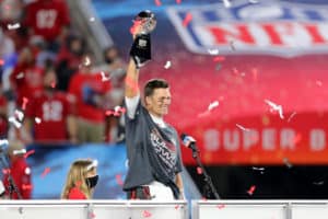 Super Bowl MVP Tom Brady (12) of the Buccaneers hoists the Lombardi Trophy after the Super Bowl LV game between the Kansas City Chiefs and the Tampa Bay Buccaneers on February 7, 2021 at Raymond James Stadium, in Tampa, FL.