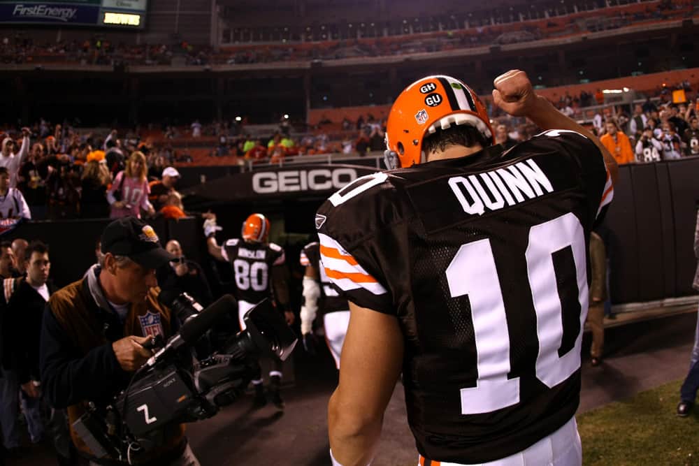 Quarterback (10) Brady Quinn of the Cleveland Browns runs off the field before playing against the Denver Broncos before the Broncos 34-30 victory over the Browns at Cleveland Browns Stadium in Cleveland, Ohio.