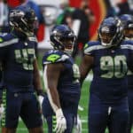 Seattle Seahawks Defensive End Carlos Dunlap (43), Nose Tackle Poona Ford (97), and Defensive Tackle Jarran Reed (90) during a game against the San Francisco at State Farm Stadium on January 3, 2021 in Glendale, Arizona.