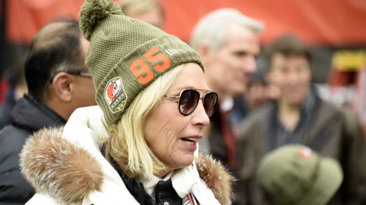 Team owner Dee Haslam of the Cleveland Browns talks with guests on the sidelines while wearing a hat supporting defensive end Myles Garrett #95 prior to the game against the Miami Dolphins at FirstEnergy Stadium on November 24, 2019 in Cleveland, Ohio.