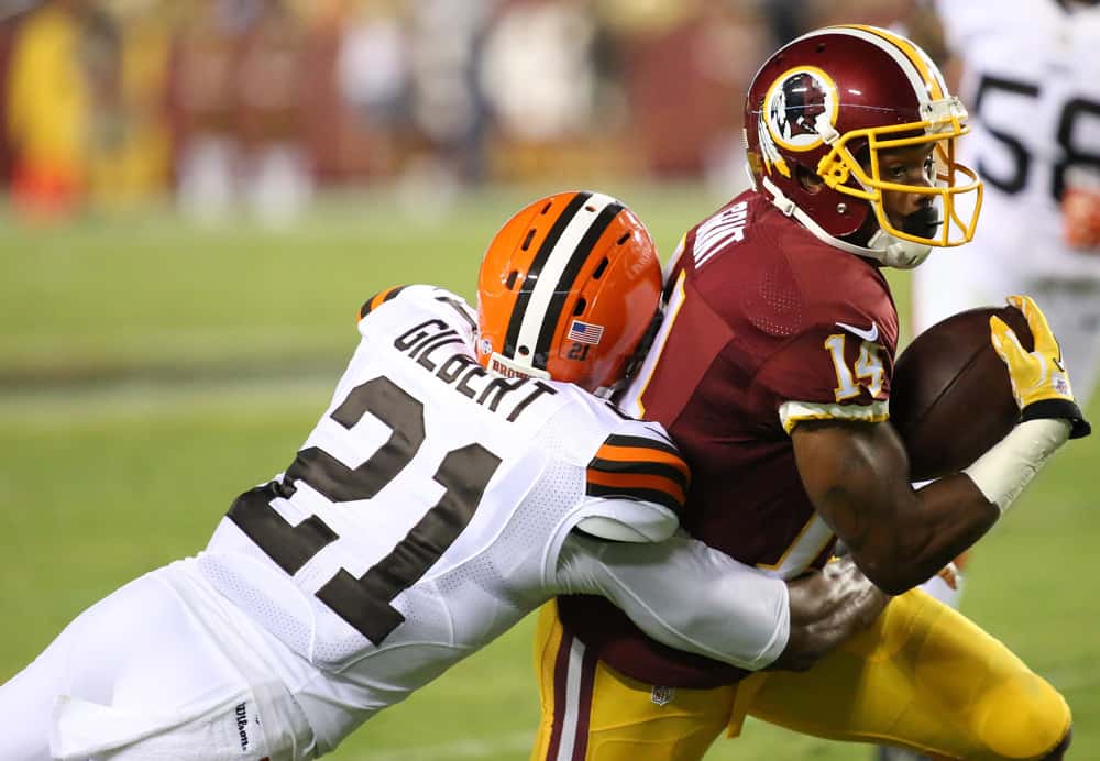 Washington Redskins wide receiver Ryan Grant (14) slips by Cleveland Browns cornerback Justin Gilbert (21) during a preseason match between the Washington Redskins and the Cleveland Browns at FedEx Field in Landover, Maryland.