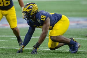 Michigan's Kwity Paye (19) prepares to rush the quarterback during the Chick-fil-A Peach Bowl between the Michigan Wolverines and the Florida Gators on December 29th, 2018 at Mercedes-Benz Stadium in Atlanta, GA.