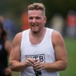 Former Colts punter Pat McAfee watches the Indianapolis Colts and Cleveland Browns joint training camp practice on August 14, 2019 at the Grand Park Sports Campus in Westfield, IN.