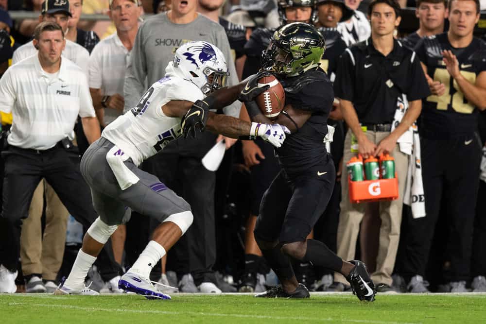 Northwestern Wildcats defensive back GregÊNewsome II (29) tackles Purdue Boilermakers wide receiver Isaac Zico (7) after a short gain during the college football game between the Purdue Boilermakers and Northwestern Wildcats on August 30, 2018, at Ross-Ade Stadium in West Lafayette, IN.